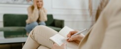 Therapist Resources making notes in woman's therapy