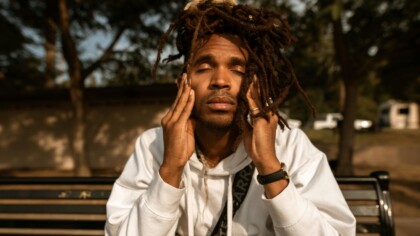 Man on bench feeling stressed